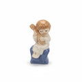Vintage Porcelain Figurine of a Boy Playing Guitar