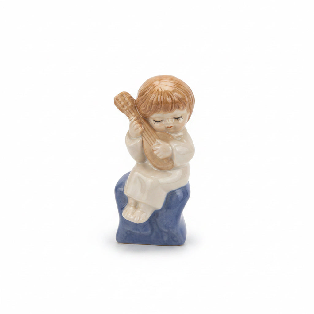 Vintage Porcelain Figurine of a Boy Playing Guitar